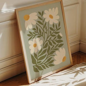 Sage green daisies printable wall art featuring soft floral elements in a muted green palette. This digital artwork blends modern botanical aesthetics with minimalist decor, perfect for living rooms, bedrooms, and stylish apartments. Available as a high-resolution digital download for instant printing