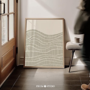 May include: A framed rectangular wall art print featuring a beige background with a pattern of sage green vertical dashes arranged in undulating, wave-like horizontal rows. The text FIRUM STUDIO is printed in white at the bottom centre.