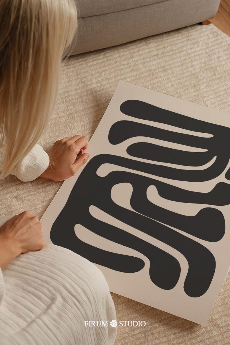 Beige and black abstract mid-century modern wall art featuring organic geometric shapes. This printable artwork blends minimalist aesthetics with neutral tones, perfect for contemporary living rooms, bedrooms, and offices. Available as a high-resolution digital download for instant printing