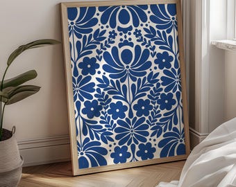 May include: A rectangular framed wall art piece featuring a repeating pattern of dark blue stylized flowers and leaves on a cream background. The frame is made of light-colored wood. The text FIRUM STUDIO is printed at the bottom center.