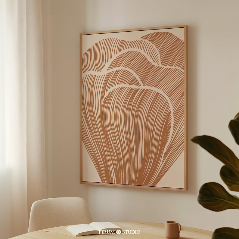 Minimalist burnt orange botanical wall art featuring an abstract floral design in warm terracotta tones. This printable artwork blends boho aesthetics with modern organic style, perfect for eclectic apartments, living rooms, and cozy interiors. Available as a high-resolution digital download for instant printing
