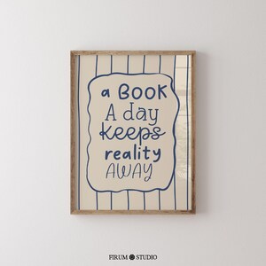Whimsical hand-drawn wall art featuring the quote “A Book A Day Keeps Reality Away” in playful navy-blue lettering on a cream background with vertical wavy stripes and a doodled frame. This charming printable is perfect for book lovers, cozy reading nooks, or eclectic dorm decor. A delightful mix of humour and escapism, ideal for adding personality to your digital download art collection or gifting to fellow bibliophiles.
