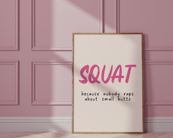 May include: A motivational quote about fitness printed on a beige poster with a pink wood frame. The quote reads "SQUAT because nobody raps about small butts".