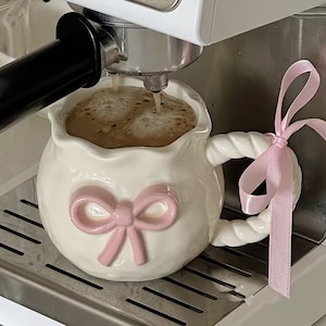 Hand-painted Ceramic Coffee Mug with a 3D Embossed Bow Pattern and a Ribbon