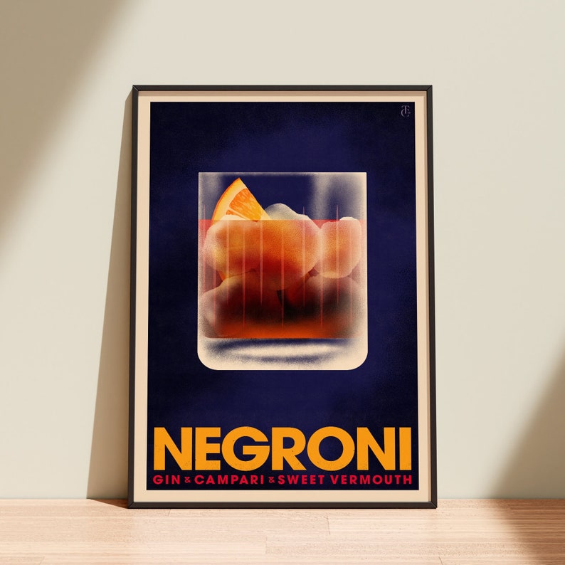 A framed vintage style print of the classic Negroni Cocktail garnished with an orange slice.