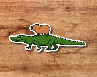 Capybara Riding an Alligator/Crocodile Vinyl Sticker