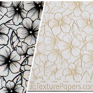 May include: A close-up of two sheets of paper with a floral pattern. The left sheet has a black and white floral pattern on a iridescent background. The right sheet has a white floral pattern embossed on a white background. The text "TexturePapers.com" is printed at the bottom of the right sheet.