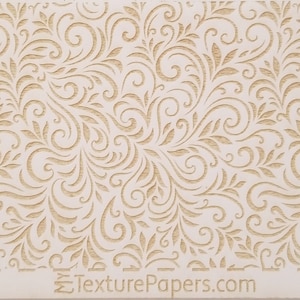May include: A white textured paper with a gold embossed design of swirling leaves and vines. The paper is labeled "Design 100240".