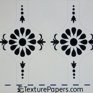 May include: A sheet of black and white decorative paper with a repeating pattern of stylized flowers. The paper is marked with a ruler in inches and the text "TexturePapers.com" and "Design 100577".
