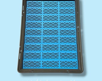 May include: A rectangular dark brown tray containing a grid of bright blue plastic inserts. Each insert features a repeating wave pattern. The text "seigaiha | ocean blue" is printed in white at the bottom of the image, identifying the design.