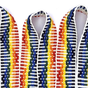 May include: Three lengths of woven fabric ribbon featuring a repeating vertical pattern of vibrant rainbow colors including red, orange, yellow, green, and blue, separated by thin white stripes and finished with a white braided edge trim.
