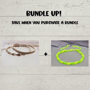 May include: Two braided friendship bracelets, one in natural beige and one in bright green and yellow.  "Bundle Up! Save when you purchase a bundle" text is displayed above the bracelets.