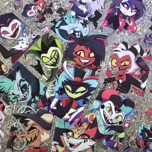 May include: A collection of colorful cartoon character stickers featuring various characters with different expressions and poses. The stickers are printed on clear plastic and have a glossy finish.