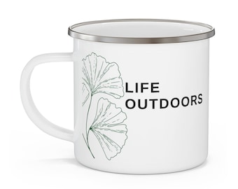 May include: White enamel camping mug with a silver rim. The mug features a green line drawing of two ginkgo leaves and the text "LIFE OUTDOORS" in black.