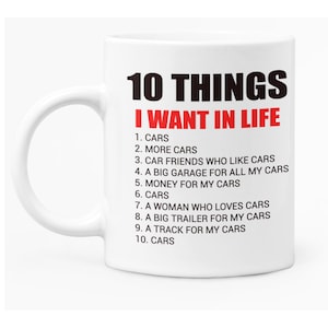 May include: White ceramic coffee mug with a black and red design. The mug features the text "10 THINGS I WANT IN LIFE" with a list of 10 items, all related to cars.