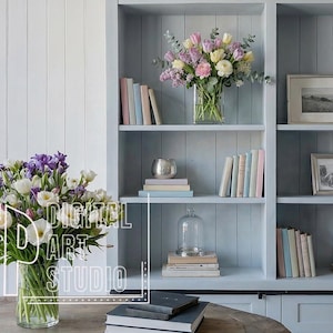May include: A light blue bookshelf with framed pictures, books, and decorative items. Two vases of flowers sit on a table and shelf. The text "DIGITAL ART STUDIO" is visible on the image.