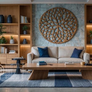 May include: A living room interior design with a light brown couch, a wooden coffee table, and a large wooden wall sculpture. The room features a large window with blinds, a potted plant, and a rug with blue and white stripes.