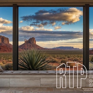 May include: A large window with a view of a desert landscape with red rock formations. The window is in a room with a white couch and a white curtain. The text "RTP DIGITAL ART STUDIO" is visible in the lower right corner of the image.
