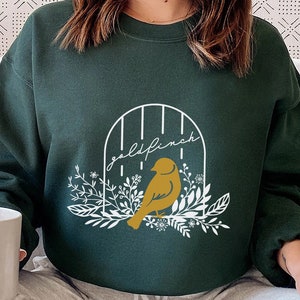 Goldfinch Sweatshirt from The Plated Prisoner Series | Raven Kennedy | Commander Rip King Ravinger Slade Slauren Gleam Glint Glow Gild Books