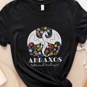 Throne of Glass Abraxos Manon T-Shirt | OFFICIALLY LICENSED | Wildflower Boutique Botanical Shop The 13 Neren Wing Leader T-shirt ToG Witch