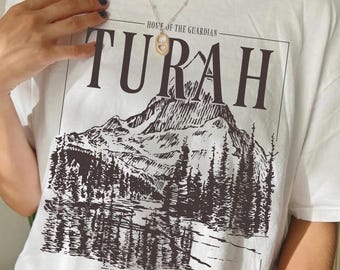 Turah Postcard T-Shirt | Officially Licensed Shield of Sparrows Devney Perry