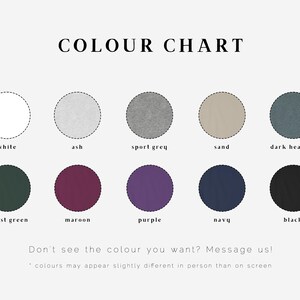 May include: Color chart showing 10 different colors of fabric swatches. The colors are white, ash, sport grey, sand, dark heather, forest green, maroon, purple, navy, and black.