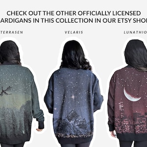 May include: Three women wearing different cardigan sweaters with unique designs. The sweaters feature a dragon, a mountain range with a star, and a crescent moon with a cityscape. The text "TERRASEN", "VELARIS", and "LUNATHION" is above each woman.