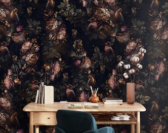 May include: A dark wood desk with a teal velvet office chair. The desk has a drawer and a lower shelf. The wall behind the desk is covered in dark floral wallpaper with birds and gold accents.