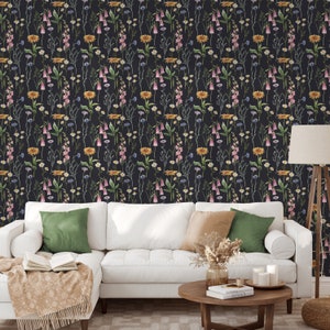 May include: A black wallpaper with a repeating pattern of watercolor wildflowers in shades of pink, yellow, and blue. The flowers are arranged in vertical rows and are set against a dark background.