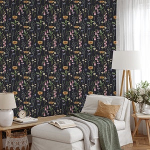 May include: A dark blue wallpaper with a repeating pattern of colorful wildflowers. The wallpaper features a variety of flowers, including daisies, bells, and sunflowers.