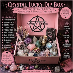 May include: A pink cardboard box labeled Coven of Genesis containing a variety of crystals, gemstones, a small candle, a glass vial, a pouch, and dried flowers. A card inside reads You are Magic. The box lists contents like tumbled stones and herbs.
