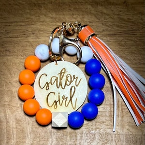 Orange and Blue University of Florida Inspried Gator Girl Silicone Bead Wristlet Keychain with Tassel and Engraved Disc, UF