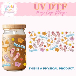 May include: A 16 ounce cup wrap with a beach theme. The design features flip flops, bikinis, cell phones, flowers, and suns. The text "BEACH" is repeated throughout the design.