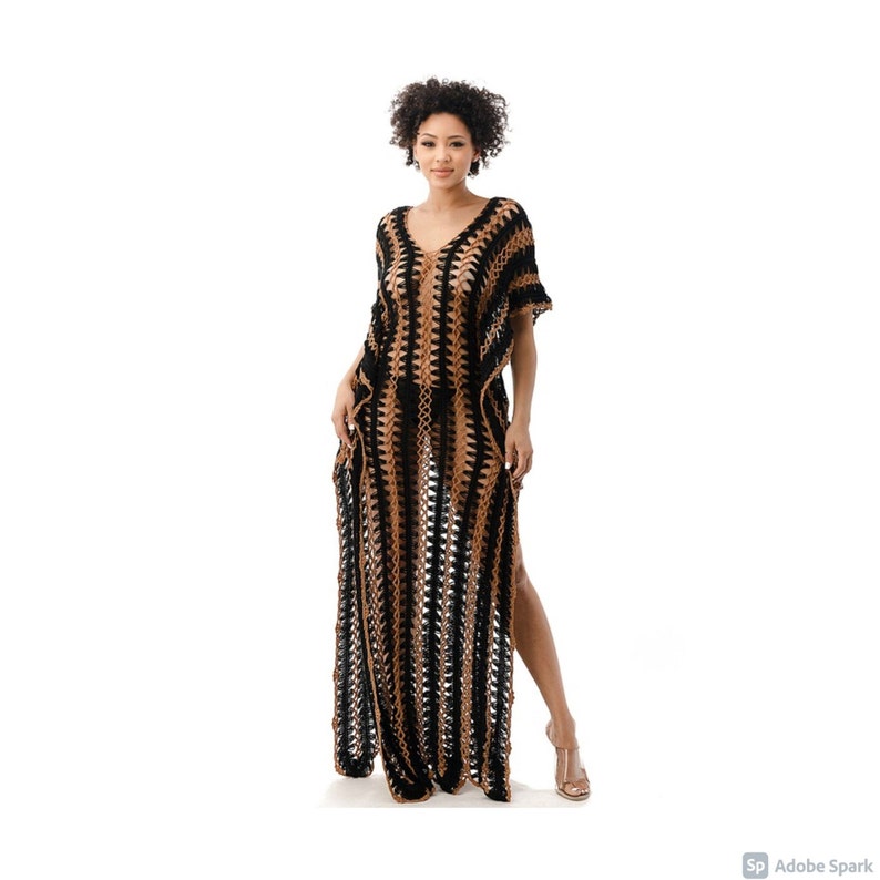 May include: A long, black and brown crochet maxi dress with a V-neckline and short sleeves. The dress has a loose, flowy fit and is perfect for a beach day or a summer evening.