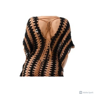 May include: A black and brown crochet cover-up with a deep V-neck and a tie at the back.