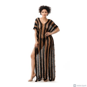 May include: A black and brown crochet maxi dress with a V-neckline and side slits. The dress is made of a lightweight, breathable fabric and is perfect for a day at the beach or a summer evening.