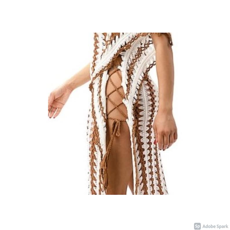 May include: A white and brown crochet maxi dress with a lace-up detail on the side.