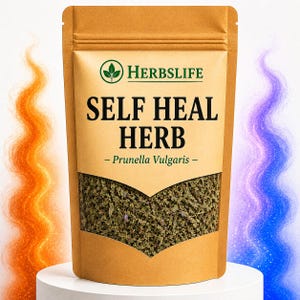 May include: A brown stand-up pouch containing dried green herbs, featuring a clear window and the text HERBSLIFE SELF HEAL HERB - Prunella Vulgaris - printed in black on the front. The packaging is centered on a white circular base.