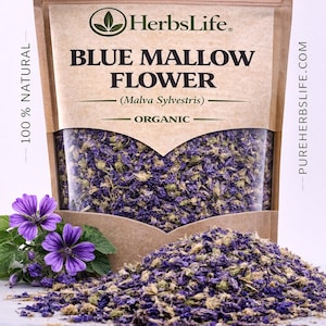 May include: A package of dried blue mallow flowers, labeled "Blue Mallow Flower" and "Organic." The image shows a clear window revealing the dried flowers, with a pile of the flowers in front and a few fresh purple flowers.