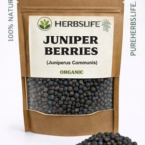 May include: A brown paper bag of juniper berries with a clear window, and a small pile of berries in front. The bag has a white label with the text "HERBSLIFE" and "JUNIPER BERRIES (Juniperus Communis) ORGANIC". The words "100% NATURAL" are printed on the left side.