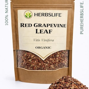 May include: A brown paper bag of red grapevine leaf with the text "RED GRAPEVINE LEAF" and "ORGANIC". A pile of the dried leaves is in front of the bag. The bag has the logo of a green leaf.