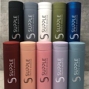 May include: Ten stainless steel water bottles in various colors, each with the logo "SUPPLE CREATE MEANING" printed on the side.