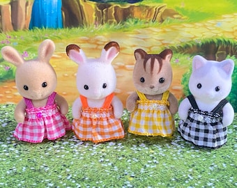 UK price shown includes postage with ONE cost at checkout NOT per item purchased Gingham elastic dress & straps for baby figure