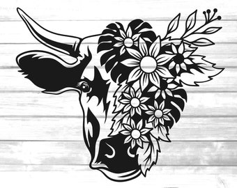 May include: Black and white silhouette of a cow's head with flowers and leaves around it.