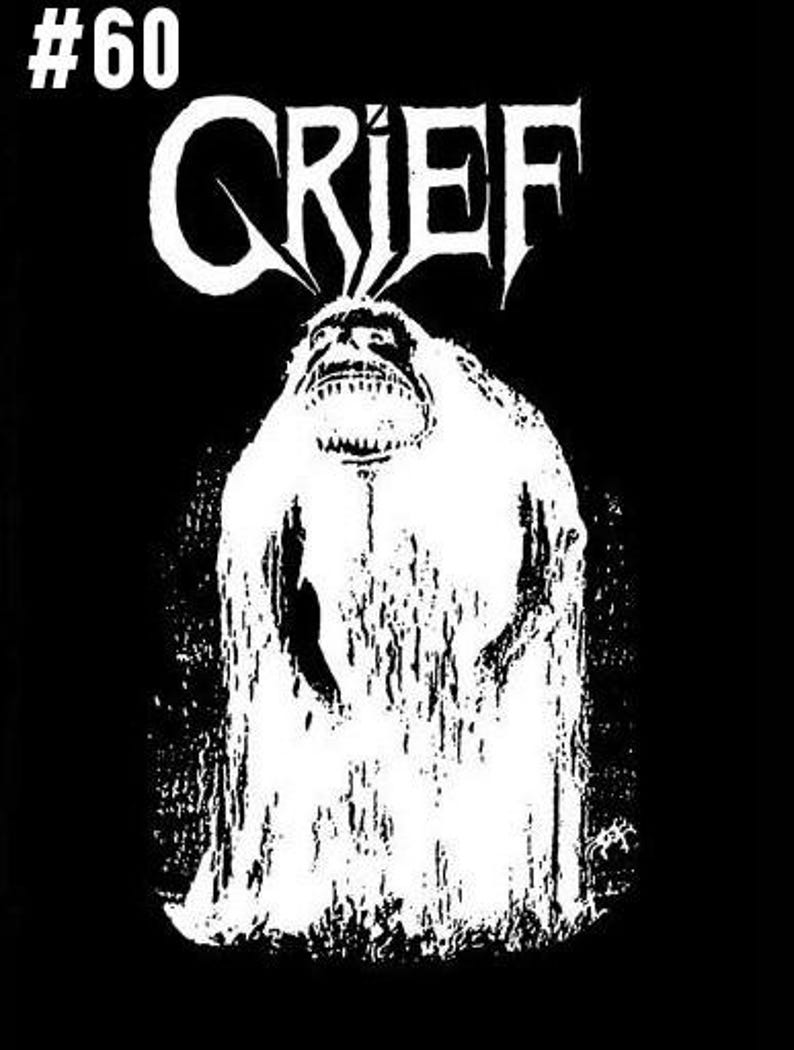 Pu&ograve; includere: Illustrazione in bianco e nero di un mostro con la parola "GRIEF" sopra. Il mostro indossa una tunica bianca e ha una grande bocca aperta.