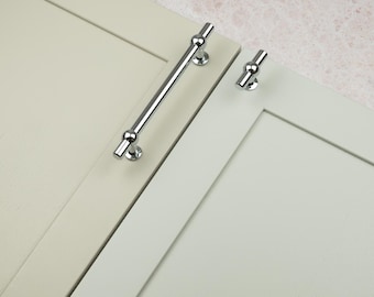 Tirador en T cromado pulido de 160 mm para armarios y perillas a juego, ideal para cocinas y dormitorios.