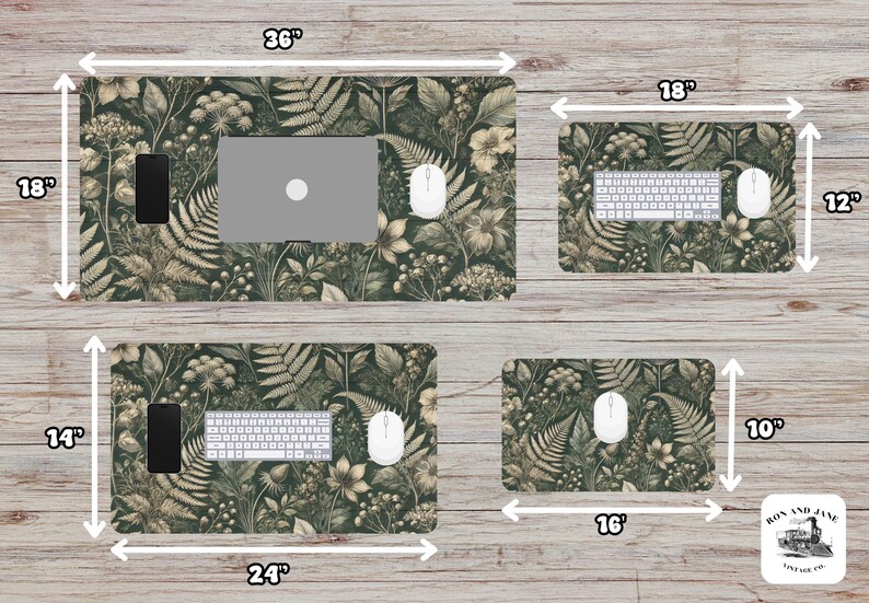 May include: A set of four desk mats featuring a botanical print with ferns and flowers in shades of green and brown. The mats are 36 inches by 18 inches, 24 inches by 14 inches, 18 inches by 12 inches, and 16 inches by 10 inches.