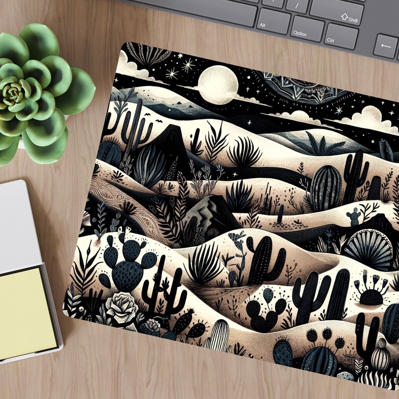 May include: A black and white illustration of a desert landscape with cacti, succulents, and a full moon in the night sky. The illustration is done in a stylized, graphic style.