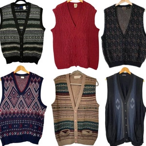 May include: A collection of ten knitted vests in various colors and patterns, including black, white, red, blue, and green. The vests are all sleeveless and have a V-neck.