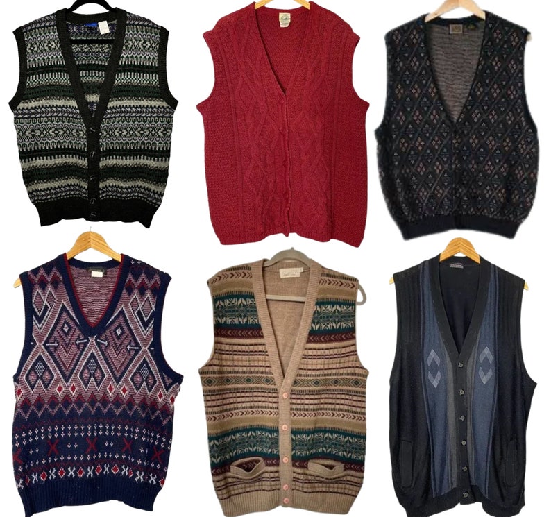 May include: A collection of ten knitted vests in various colors and patterns, including black, white, red, blue, and green. The vests are all sleeveless and have a V-neck.